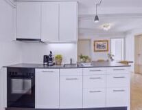 cabinet, indoor, cabinetry, sink, kitchen appliance, home appliance, countertop, drawer, design, wall, interior, cupboard, chest of drawers, home, microwave oven, kitchen, gas stove, refrigerator, oven, major appliance